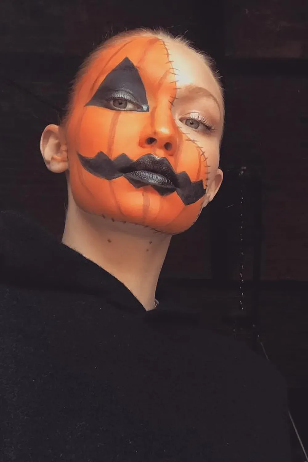 Gigi Hadid dresses up as a jack-o-lantern for Halloween in 2018.