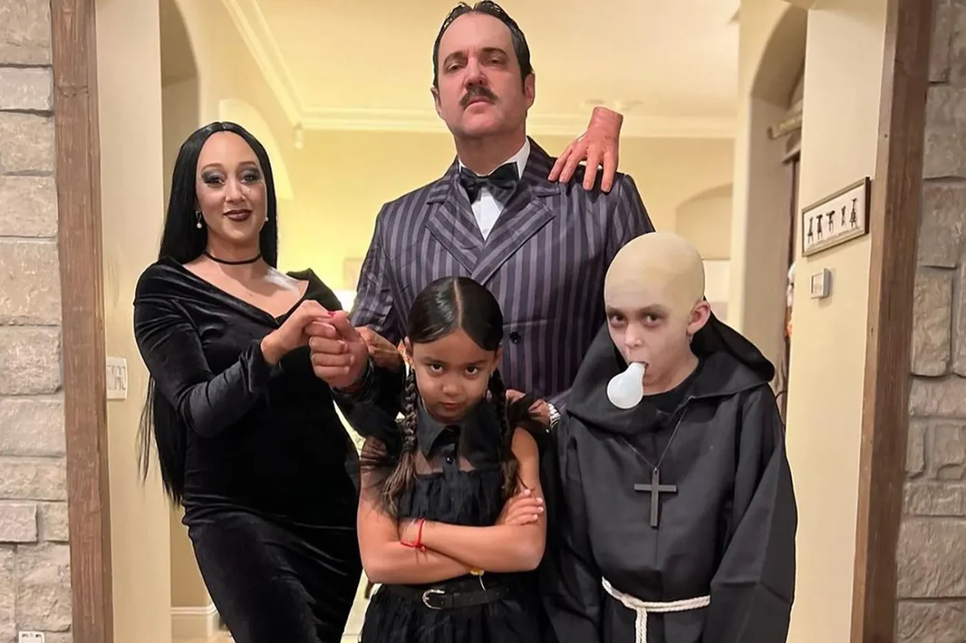 Tamera Mowry and her family dress up as the Addams Family for Halloween 2023.